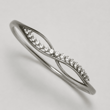 The "Forever Yours" Infinity Bangle — Silver-Tone Infinity Bangle by House of Zena, flat lay
