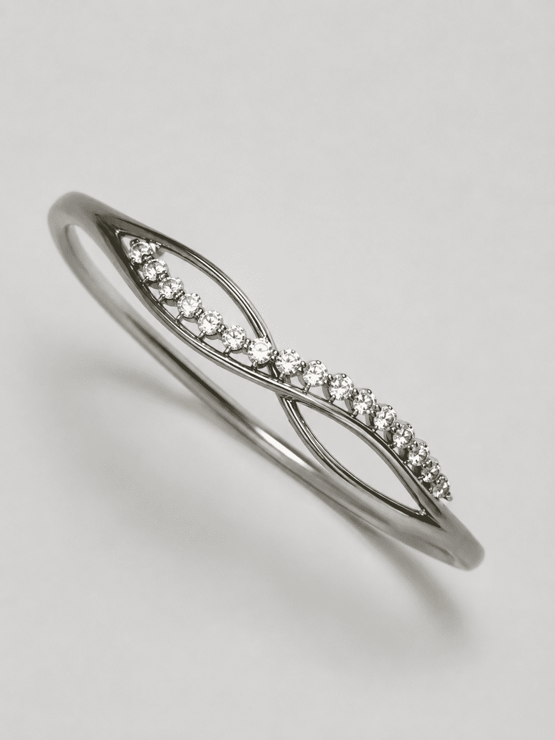 The "Forever Yours" Infinity Bangle — Silver-Tone Infinity Bangle by House of Zena, flat lay