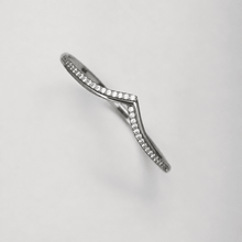 The "Kiss Me" Crisscross Bangle — Silver-Tone Twist Pavé Bangle by House of Zena, worn on model