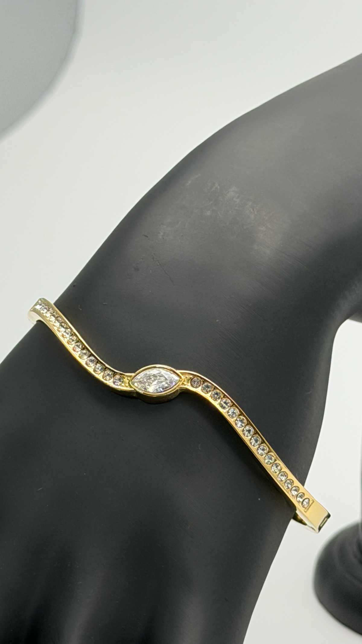 The "Liquid Asset" Sculpted Cuff Bracelet — Studio Packshot (Angle 2)